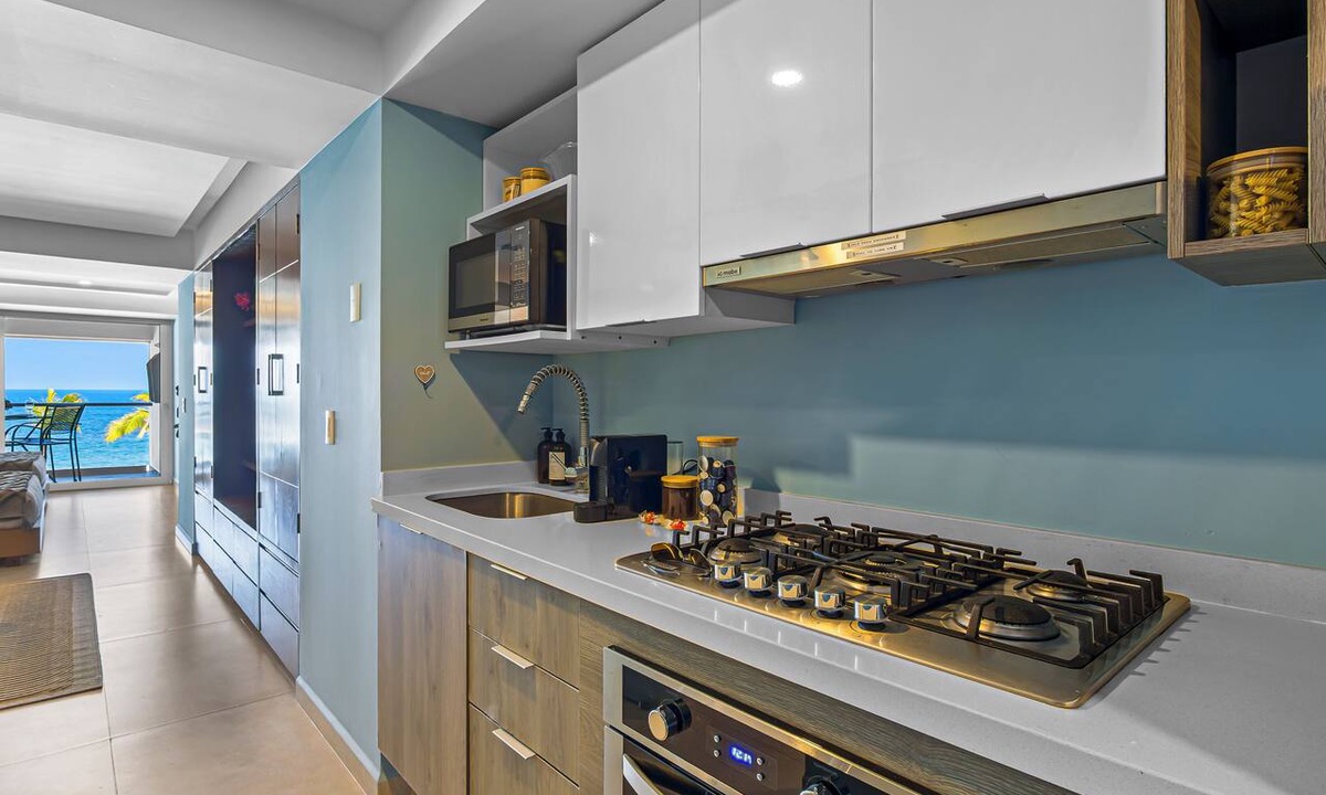 Las Glorias Apartment | Gorgeous 1BR with Pools & Sea Views