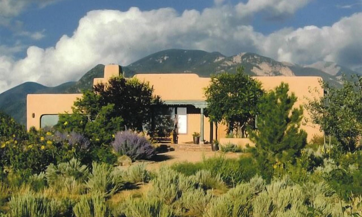 Arroyo Seco House | Sweeping panoramic mountain views, expansive adobe privacy wall system
