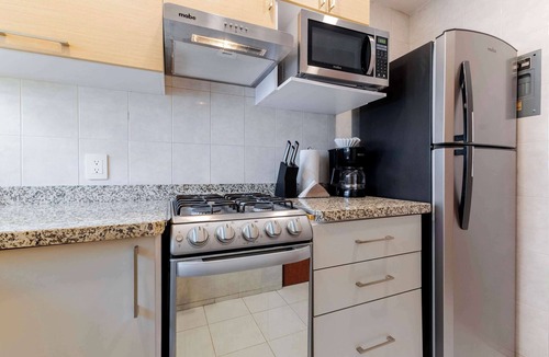 Anahuac Condo | Capitalia | Bright balcony + Bike & Leafy Views