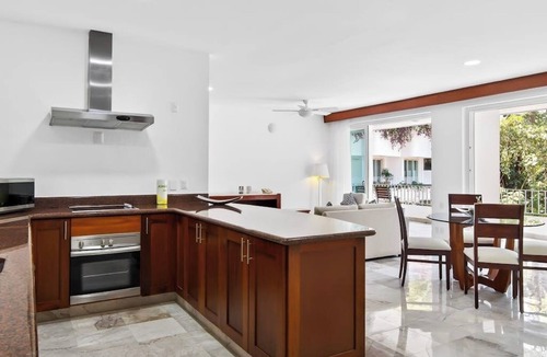 Conchas Chinas Apartment | Modern hillside suite with balcony, city view, pools, gym & full kitchen