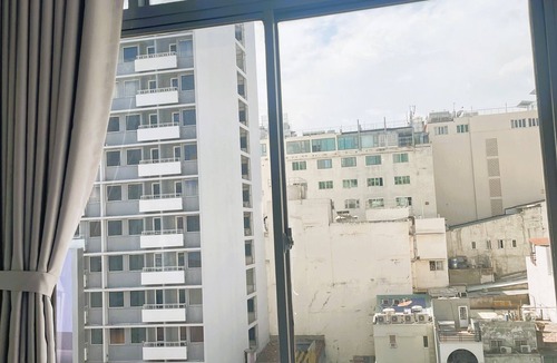 Bach Dang Riverside Apartment | The Cafe Apartments Building - Deluxe King room has a large window