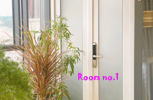 Bach Dang Riverside Apartment | The Cafe Apartments Building - Deluxe King room has a large window