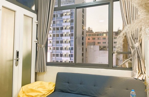 Bach Dang Riverside Apartment | The Cafe Apartments Building - Deluxe King room has a large window