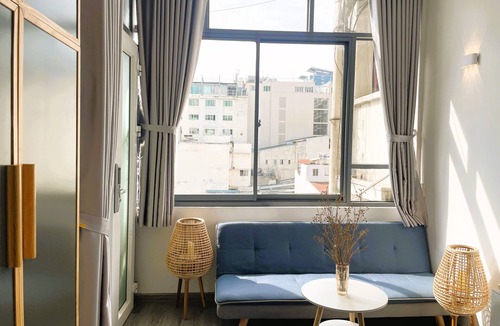 Bach Dang Riverside Apartment | The Cafe Apartments Building - Deluxe King room has a large window