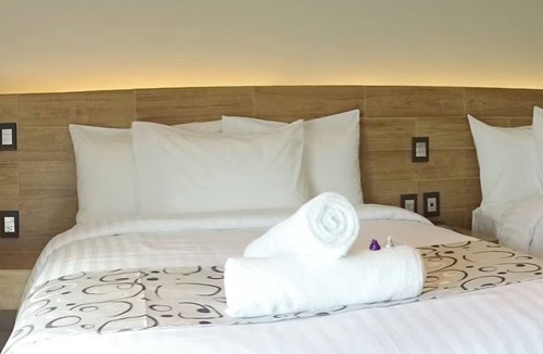 Downtown Cancun Hotel | Three Central Room Perfect for Groups Exploring Cancún’s Hidden Gems