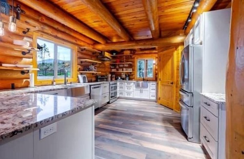Gates House | Tranquil River Front log cabin retreat