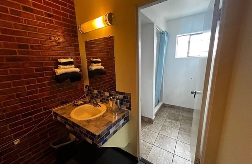 Longview Hotel | Warm, Inviting Room Perfect for Weekend Getaways Near Downtown Longview