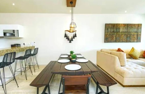 Zama Apartment | Your Tulum escape awaits by HEUSHAVEN. Relax in a private rooftop pool, enjoy tropical views from 3 balconies, 3 bedrooms with smart TV's, and stay minutes from beaches, cenotes, dining, and nightlife.