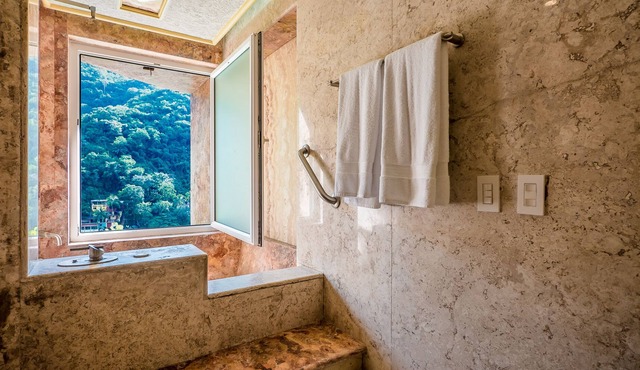 Beautiful suite with two king size beds, with a large terrace with beach view