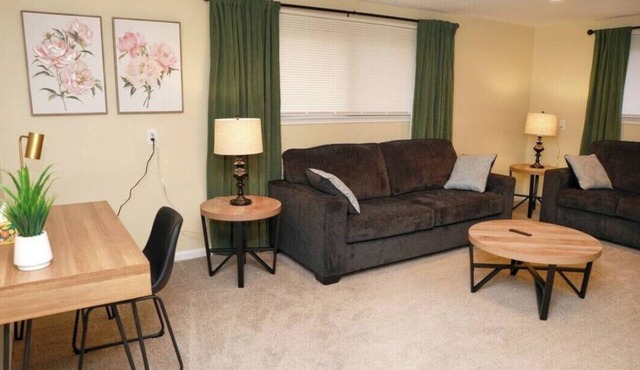 Cozy spacious 4-bedroom home nestled in wooded lot with enclosed porch in Commerce twp