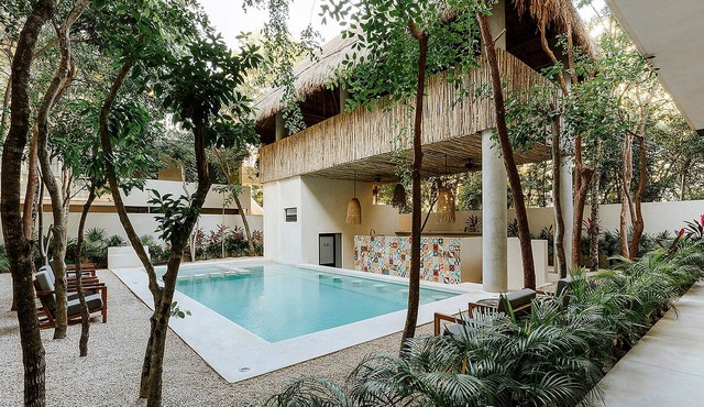 Spacious modern 3-bedroom condo in Aldea Zama with premium finishes, a lush shared pool, and easy access to restaurants, shops, and Tulum’s beaches. in Tulum