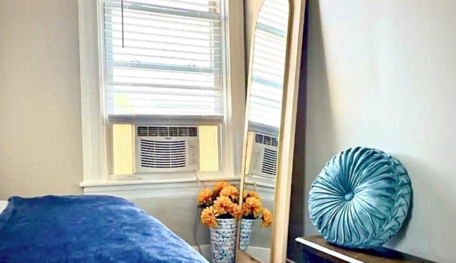 Step into a serene stay where electric charm meets cozy coastal tranquility. in Pawtucket