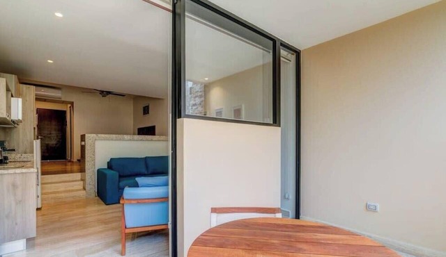 Stylish Playa Condo: Rooftop Pool, Gym, Near Beach in Playa del Carmen