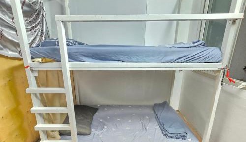 Single Bed in Dormitory Room